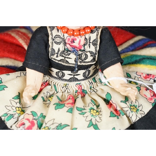 299A - Three early 20th century Heubach Koppelsdorf bisque headed dolls, clothed, with composition limbs, g... 