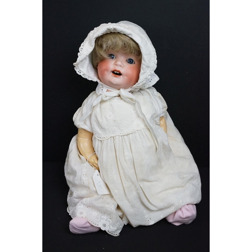 299A - Three early 20th century Heubach Koppelsdorf bisque headed dolls, clothed, with composition limbs, g... 