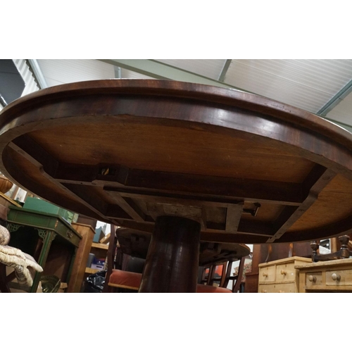 635 - 19th century Flamed Mahogany Circular Tilt Top Breakfast Table raised on a plain turned pillar suppo... 