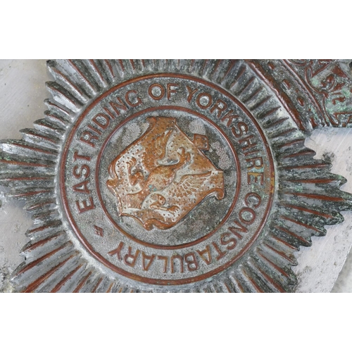 217 - A vintage kings crown East Riding of Yorkshire constabulary helmet badge together with a QC Bucks Co... 