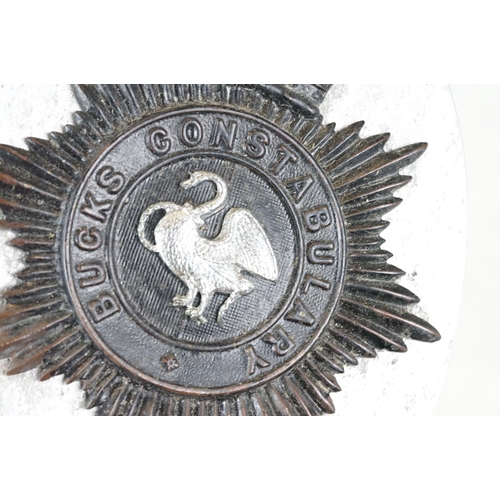 217 - A vintage kings crown East Riding of Yorkshire constabulary helmet badge together with a QC Bucks Co... 