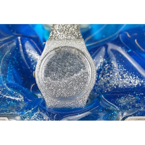 232 - Swatch silver glitter watch having a silver glitter strap and further glitter housed in the face set... 