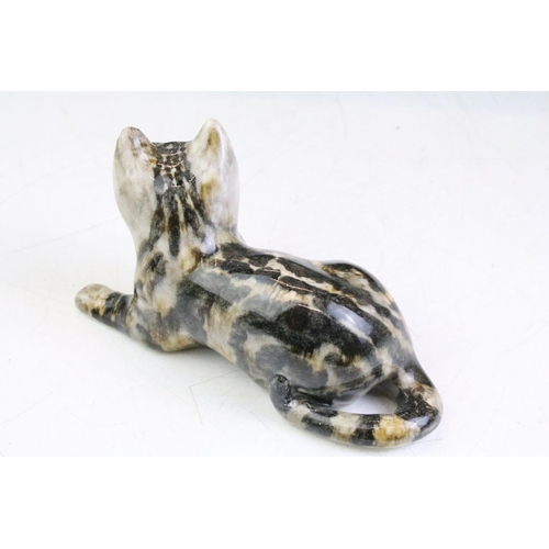 10 - Three Winstanley Pottery cat figures with glass eyes, to include a recumbent tabby cat (size 2), a t... 