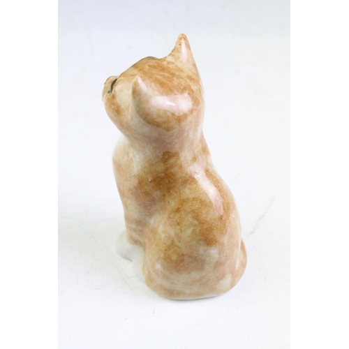 11 - Two Winstanley Pottery Ginger Cats, size 1, with glass eye, to include a seated and standing example... 