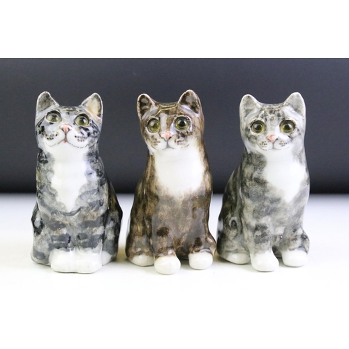 19 - Three Winstanley Pottery Tabby Cats, size 1, with glass eyes, signed 'Winstanley England' to bases, ... 