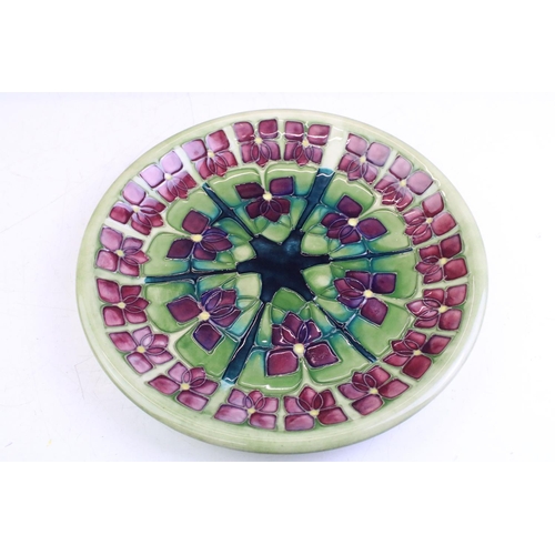 28 - Three boxed Moorcroft pottery dishes to include a Violet pattern green ground circular dish (date ma... 