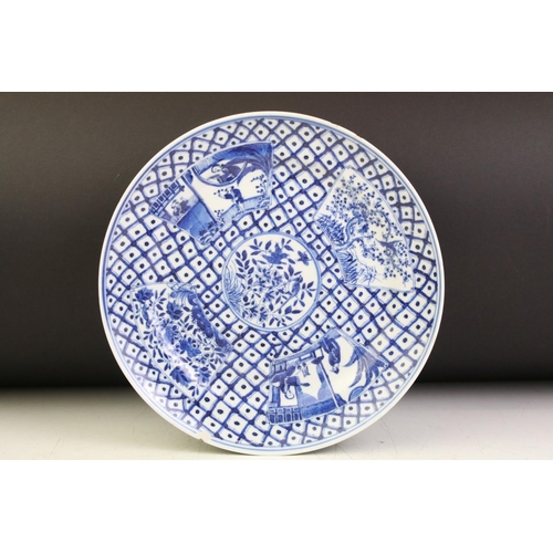 65 - Chinese blue & white plate decorated with floral, foliate & figural panels on a geometric ground (24... 