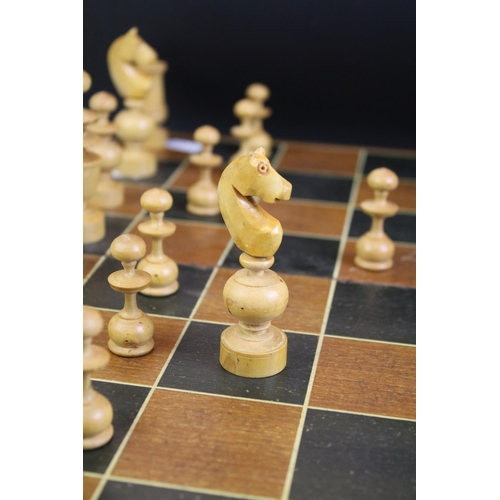 352 - Wooden chess set with boxwood & ebonised pieces, with folding board, measures approx 43cm wide