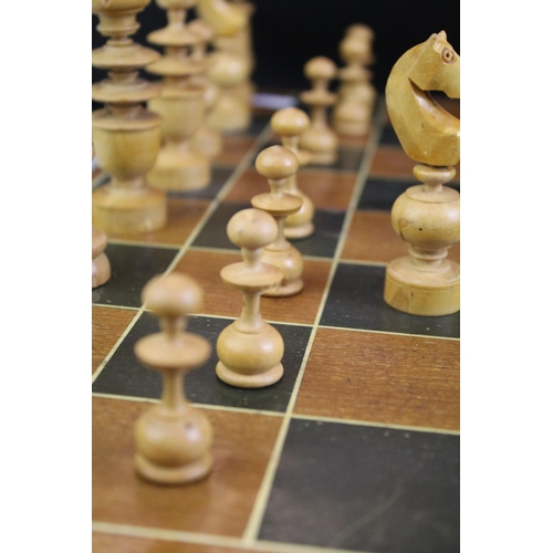 352 - Wooden chess set with boxwood & ebonised pieces, with folding board, measures approx 43cm wide