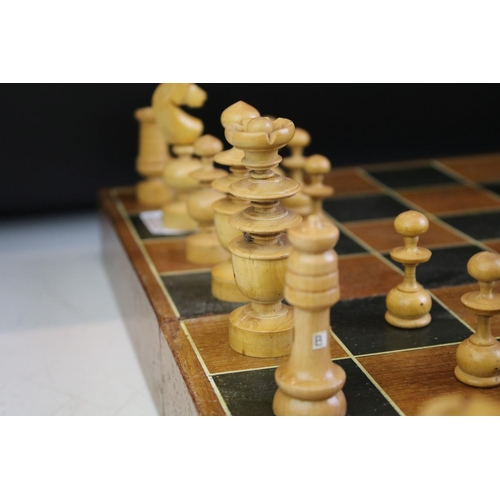 352 - Wooden chess set with boxwood & ebonised pieces, with folding board, measures approx 43cm wide