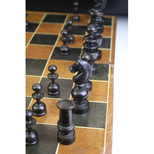 352 - Wooden chess set with boxwood & ebonised pieces, with folding board, measures approx 43cm wide