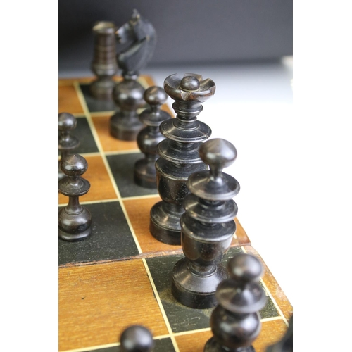 352 - Wooden chess set with boxwood & ebonised pieces, with folding board, measures approx 43cm wide