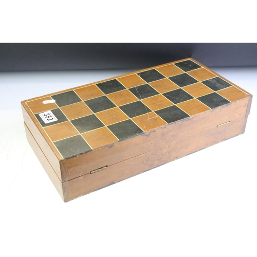 352 - Wooden chess set with boxwood & ebonised pieces, with folding board, measures approx 43cm wide