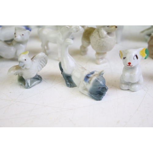 72 - Collection of around 30 small ceramic animal figures, featuring Wade & Tosca of Italy