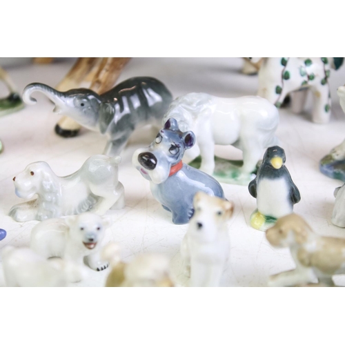 72 - Collection of around 30 small ceramic animal figures, featuring Wade & Tosca of Italy