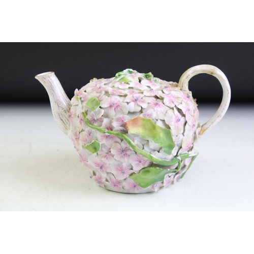 78 - Continental porcelain floral encrusted teapot & cover, together with a Continental floral encrusted ... 