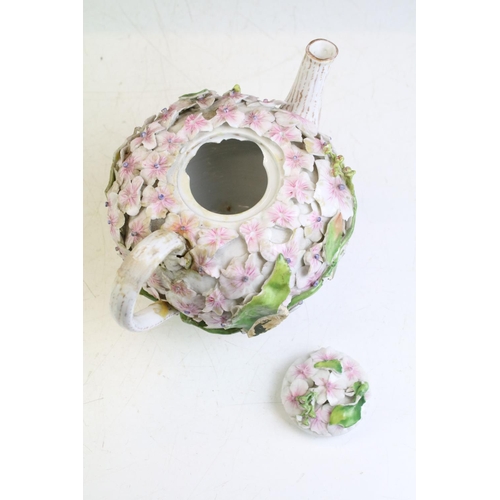 78 - Continental porcelain floral encrusted teapot & cover, together with a Continental floral encrusted ... 