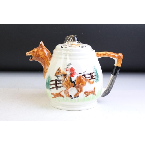 93 - PPC Hunting Scene porcelain tea ware with moulded decoration, to include teapot, water jug and 2 x m... 