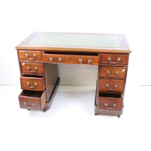 595 - Victorian Mahogany Twin Pedestal Desk with green leather inset top and an arrangement of nine drawer... 