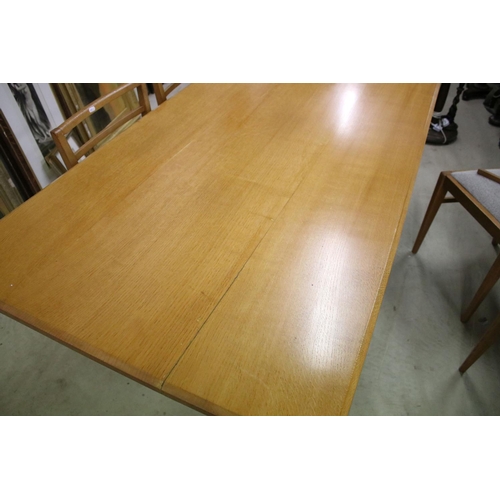 597 - In the manner of Heals of London, Pale Oak Rectangular Dining Room Table with chamfered edge, raised... 