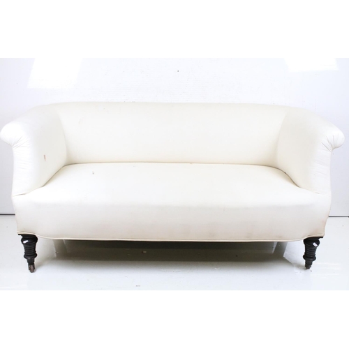 606 - Late 19th / Early 20th century Chesterfield style Sofa covered in plain calico fabric, raised on tur... 