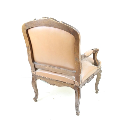 609 - French Carved Walnut Open Armchair with brown leather upholstered back, seat and elbow pads. 95cm hi... 