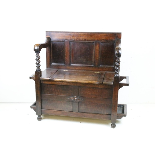 618 - Early to Mid 20th century Oak Hall Seat with panelled back and lift up hinged box seat, the arms wit... 