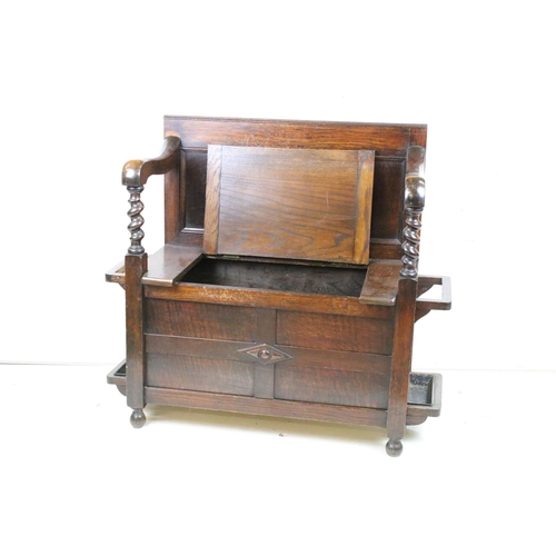 618 - Early to Mid 20th century Oak Hall Seat with panelled back and lift up hinged box seat, the arms wit... 