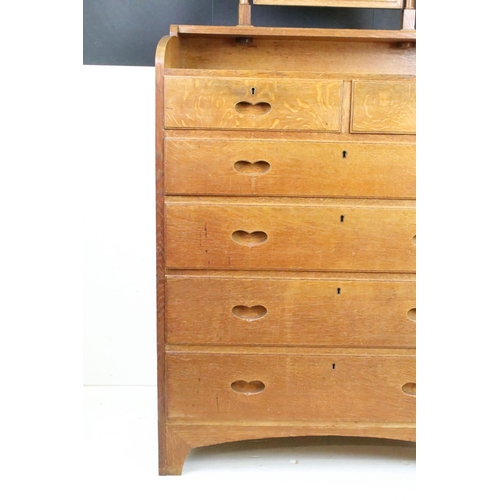 605 - Arts and Crafts Chestnut Dressing Chest with swing mirror over a chest of two short and four long dr... 