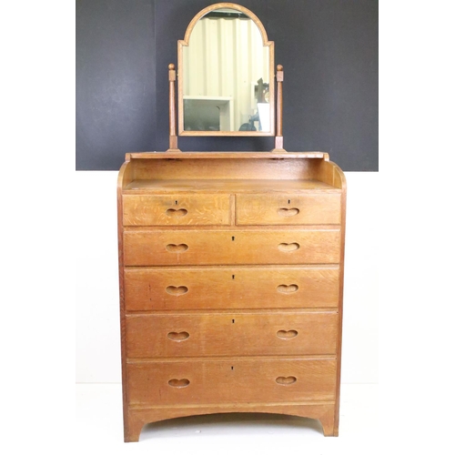 605 - Arts and Crafts Chestnut Dressing Chest with swing mirror over a chest of two short and four long dr... 