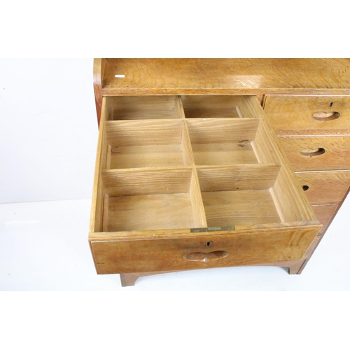 605 - Arts and Crafts Chestnut Dressing Chest with swing mirror over a chest of two short and four long dr... 