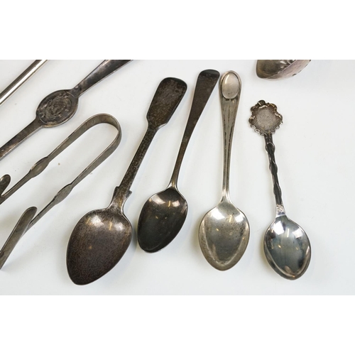 209 - A small collection of mixed silver and silver plated cutlery to include napkin ring, knife rests, sp... 