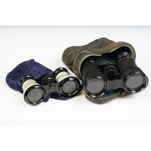 215 - Two pairs of opera glasses to include a cased set.