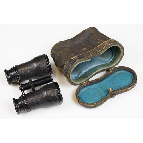 215 - Two pairs of opera glasses to include a cased set.