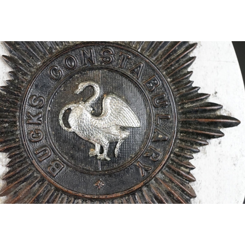 217 - A vintage kings crown East Riding of Yorkshire constabulary helmet badge together with a QC Bucks Co... 