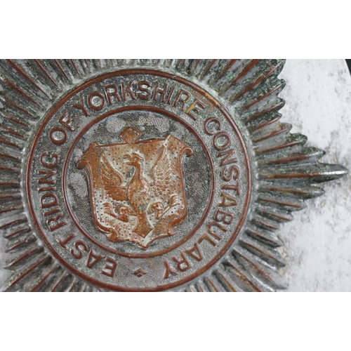 217 - A vintage kings crown East Riding of Yorkshire constabulary helmet badge together with a QC Bucks Co... 