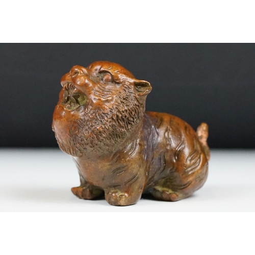 218 - An ornamental Chinese bronze tiger, stands approx 4cm in height.