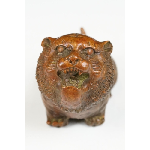 218 - An ornamental Chinese bronze tiger, stands approx 4cm in height.