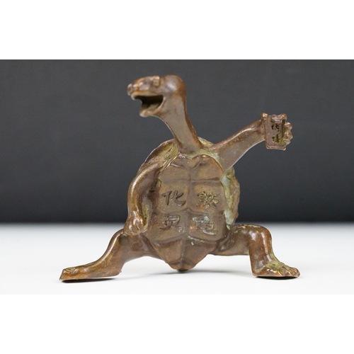 219 - An oriental lucky turtle ornament with character marks, stands approx 6cm in height.