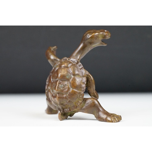 219 - An oriental lucky turtle ornament with character marks, stands approx 6cm in height.