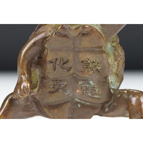 219 - An oriental lucky turtle ornament with character marks, stands approx 6cm in height.