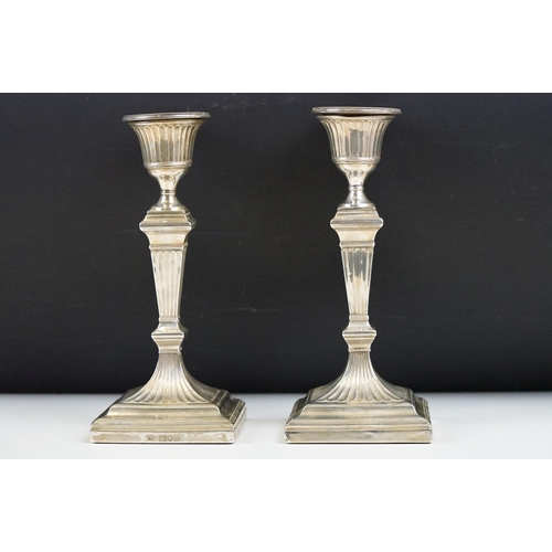 220A - A pair of fully hallmarked sterling silver candlesticks, assay marked for London and dated for 1899.