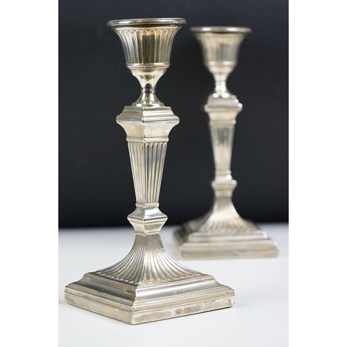 220A - A pair of fully hallmarked sterling silver candlesticks, assay marked for London and dated for 1899.