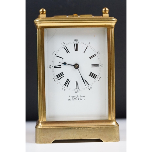 222 - An antique French brass cased carriage clock with beveled glass panels, repeater button to top, reta... 