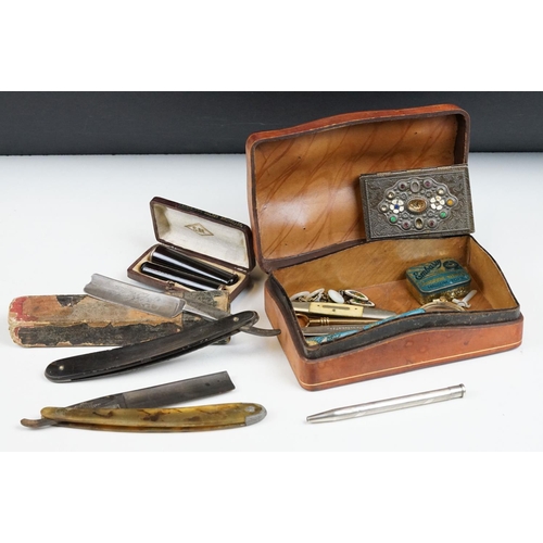 229 - Antique leather box with contents including two cased cheroot holders, lorgnettes, Gramophone needle... 