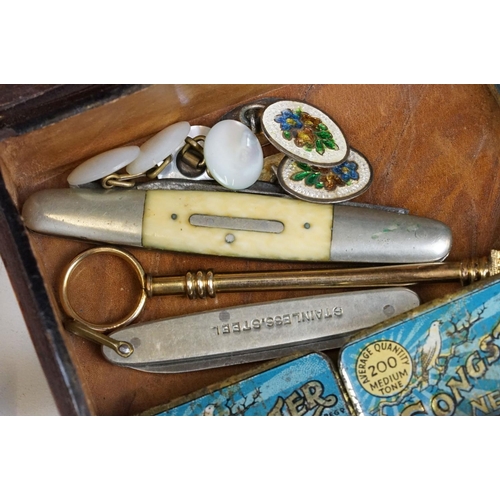 229 - Antique leather box with contents including two cased cheroot holders, lorgnettes, Gramophone needle... 