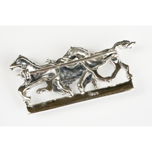 251 - Silver Horse Brooch set with a Ruby platform