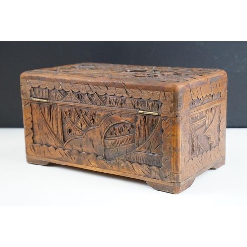 130 - 19th Century mahogany box of sarcophagus form, opening to a three compartment interior (25.5cm wide)... 