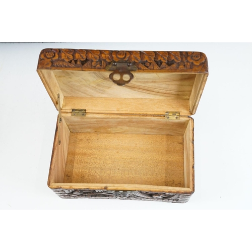 130 - 19th Century mahogany box of sarcophagus form, opening to a three compartment interior (25.5cm wide)... 