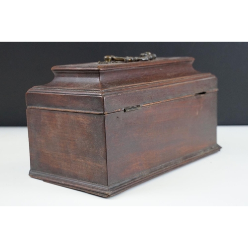 130 - 19th Century mahogany box of sarcophagus form, opening to a three compartment interior (25.5cm wide)... 